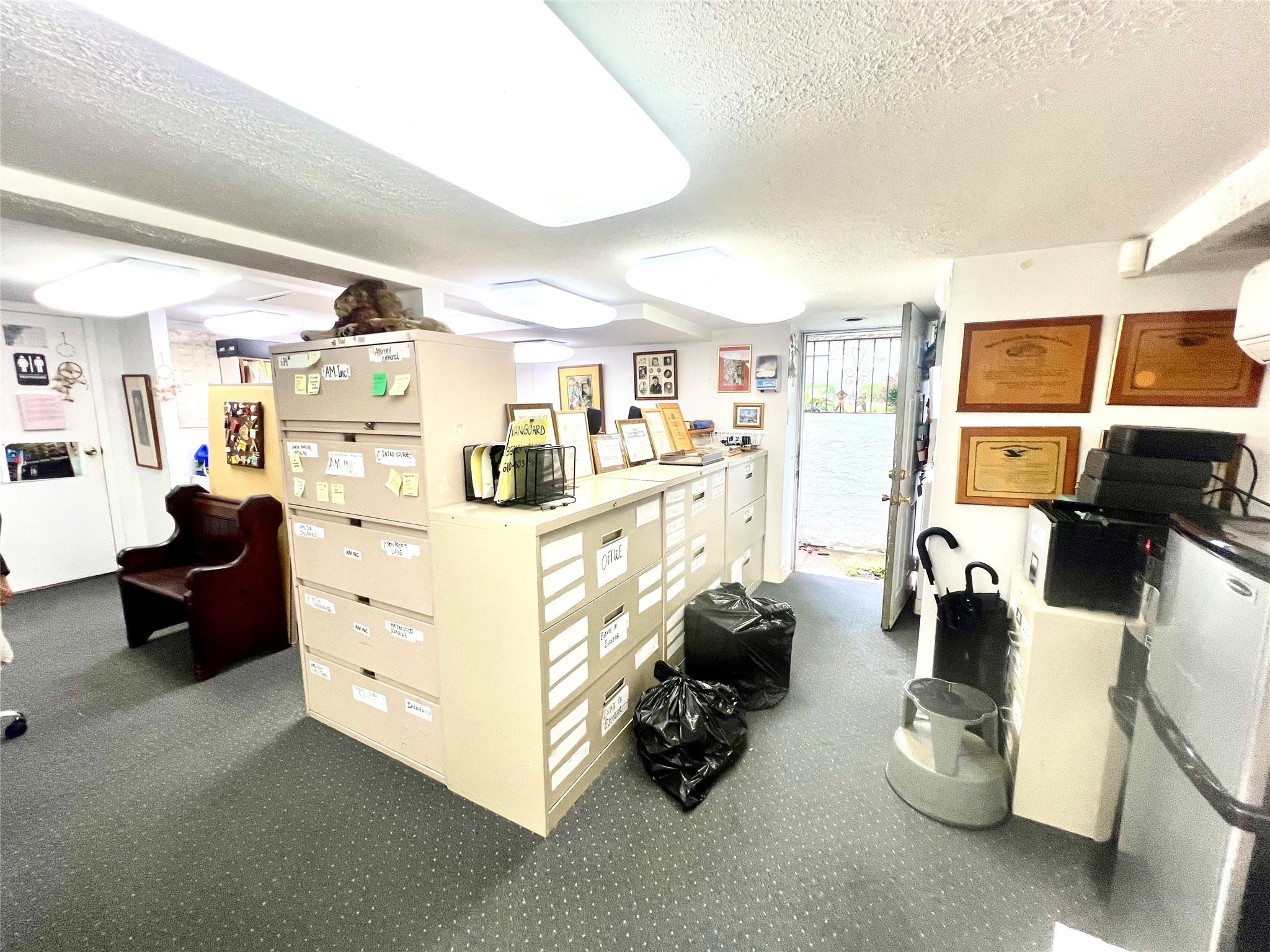 11 Pearl Street Valley Stream, NY 11581 - Photo 13 of 17 a room with gym equipment and a view of living room