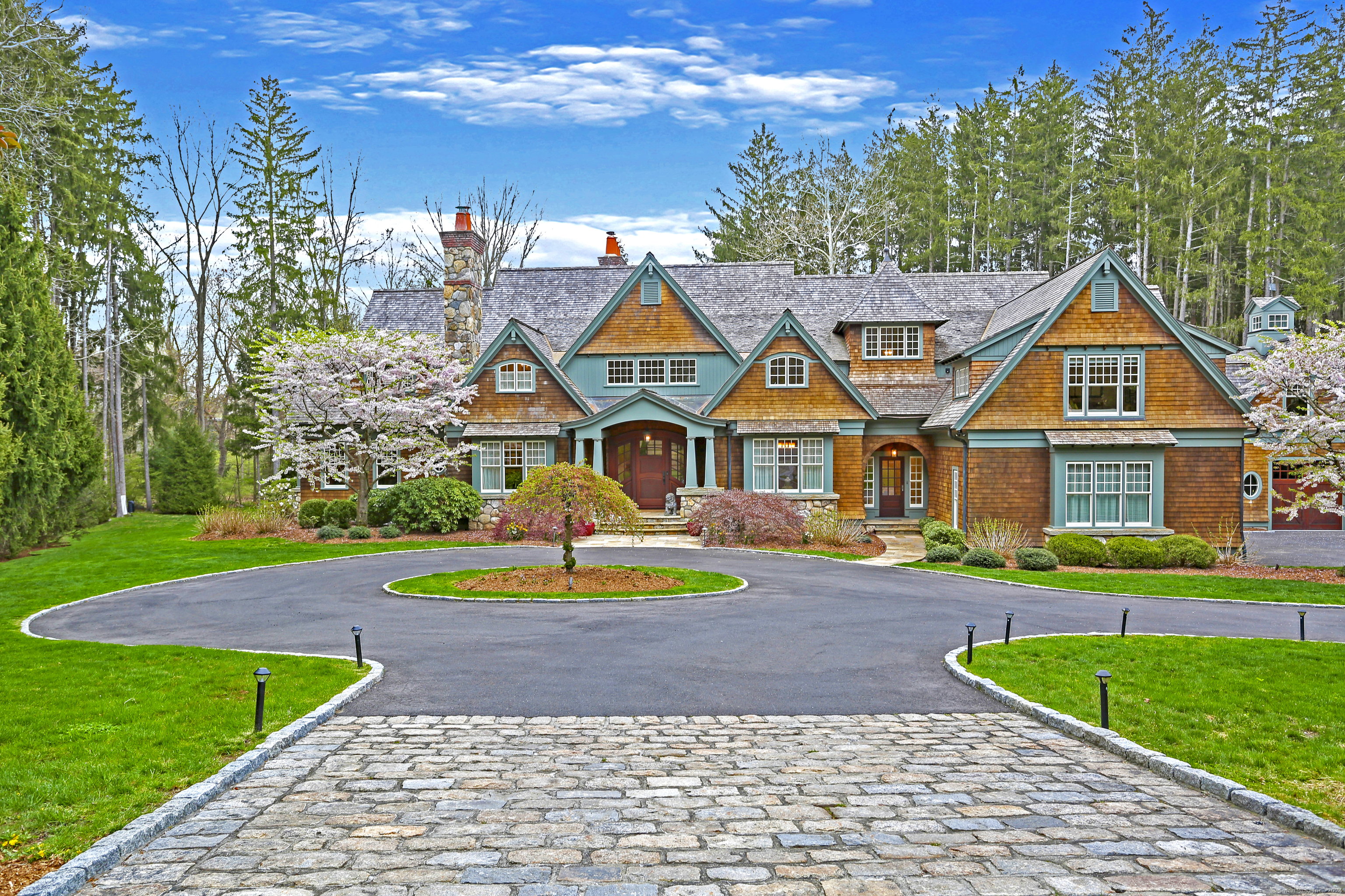 6 Pan Handle Lane Westport, CT 06880 - Photo 1 of 1 a view of a big house with a big yard and potted plants