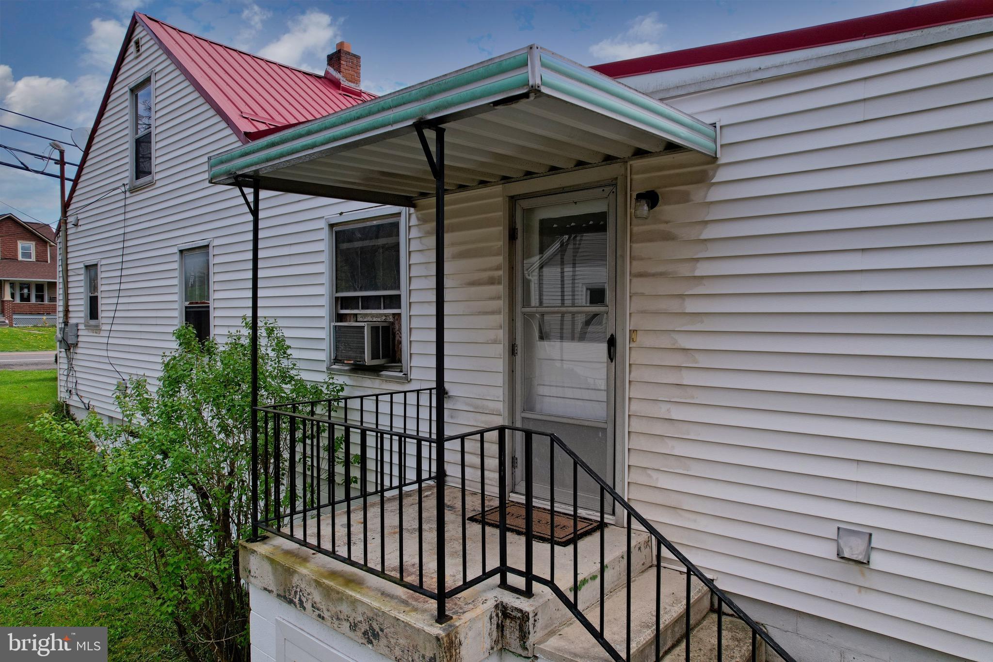 159 Rocket Center Road Keyser, WV 26726 - Photo 60 of 64 a view of a house with a small deck and a small yard