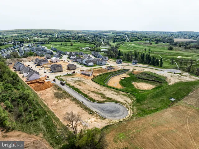 an aerial view of a house with yard swimming pool and outdoor seating