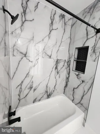 a bath tub sitting in a bathroom