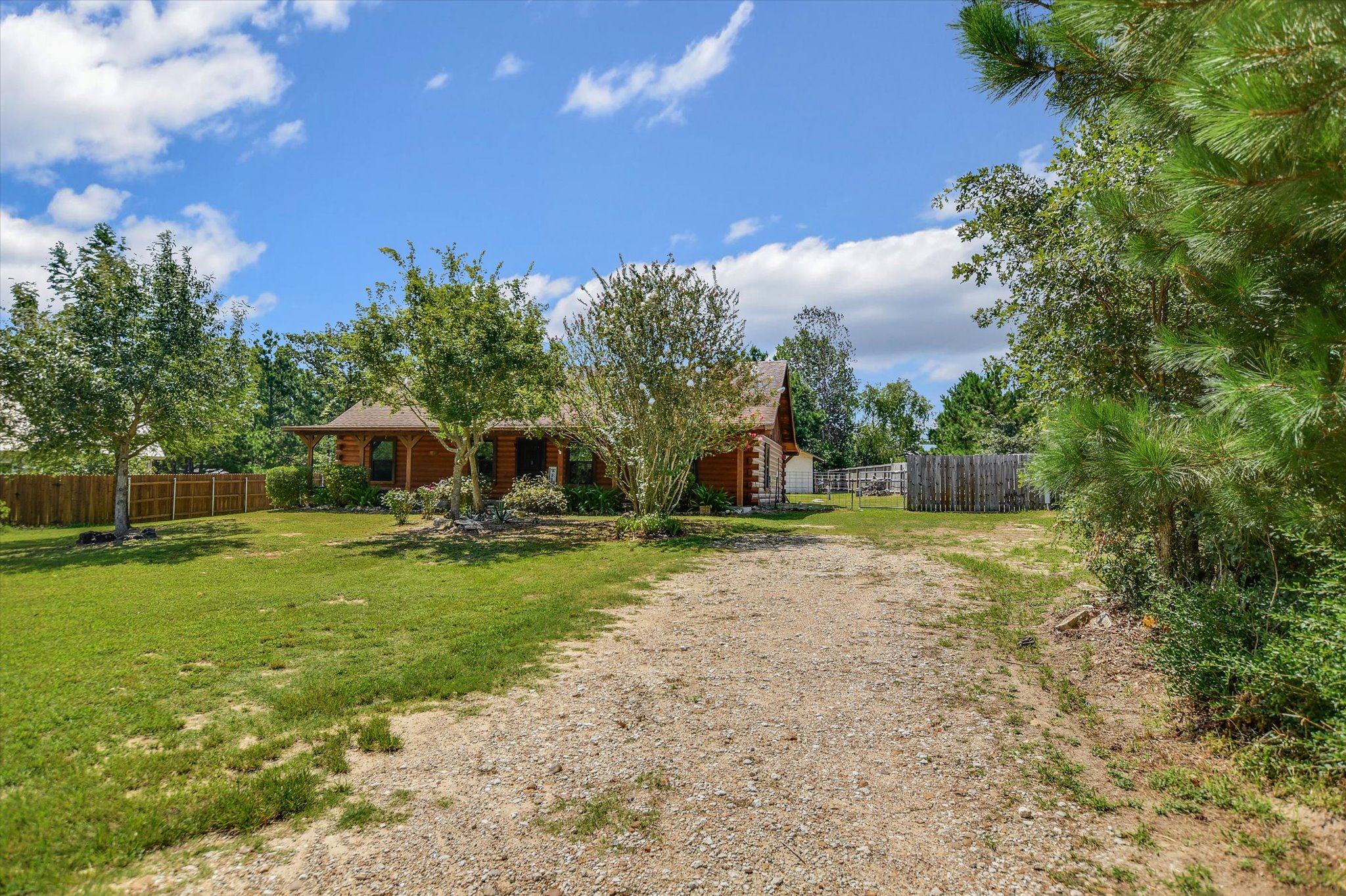218 Cardinal Loop Paige, TX 78659 - Photo 2 of 22 Gravel driveway
