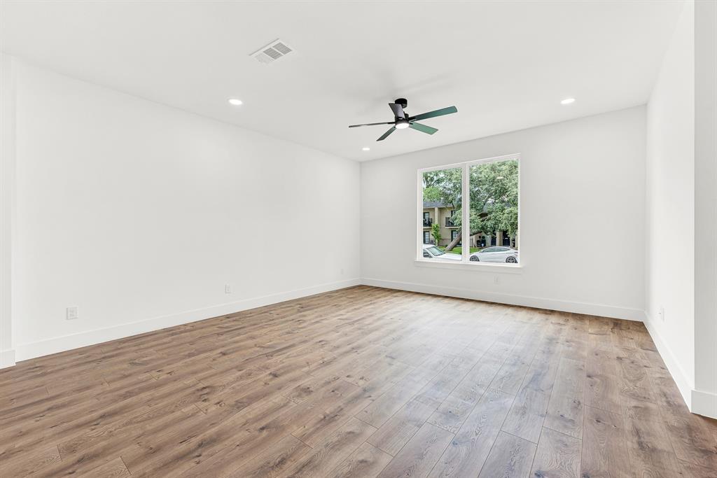 9471 Timberleaf Drive Dallas, TX 75243 - Photo 29 of 39 Spacious room featuring wood-finish flooring, recessed lighting, and a contemporary ceiling fan