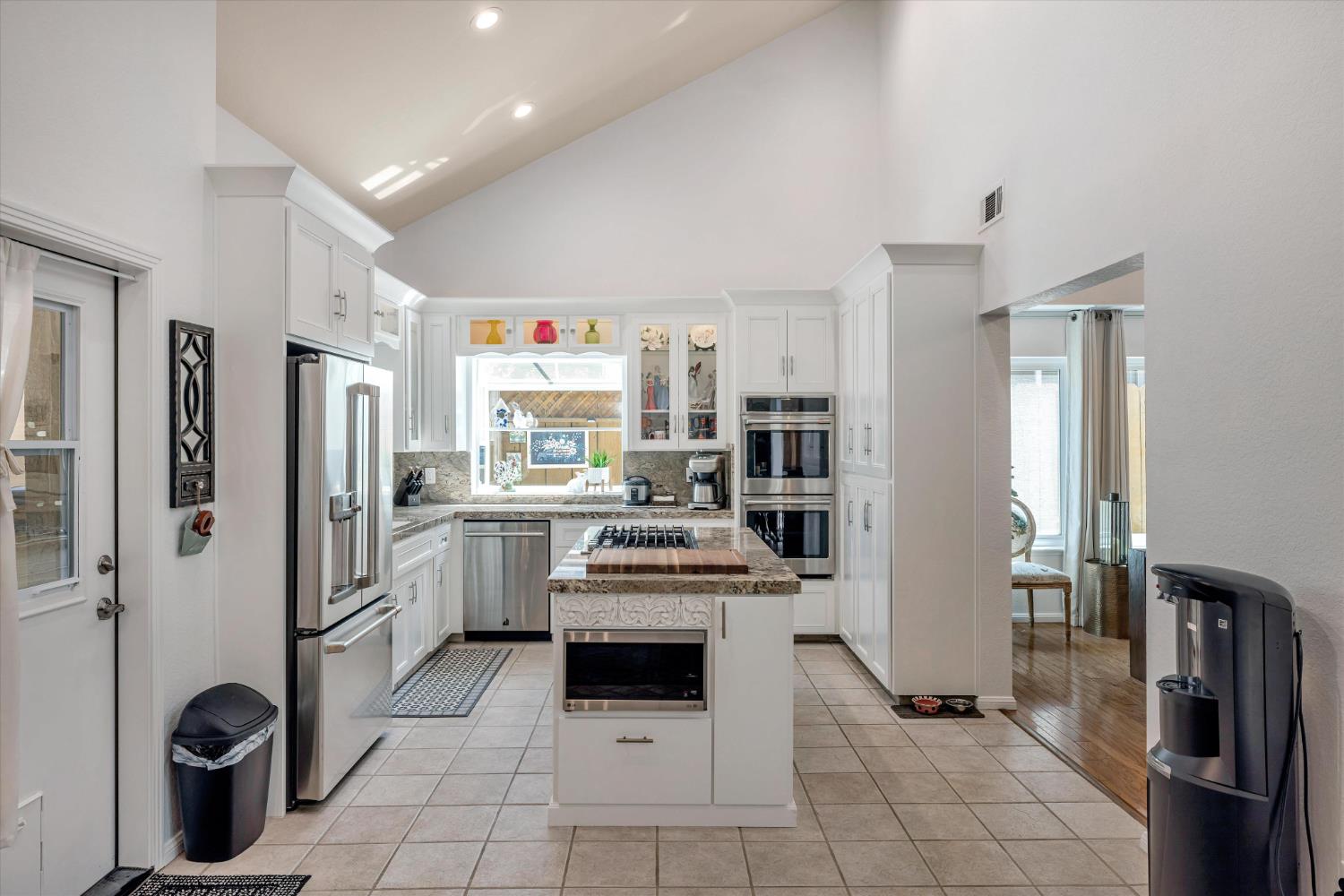 1412 Seneca Place Modesto, CA 95358 - Photo 16 of 62 a kitchen with a sink cabinets and stainless steel appliances