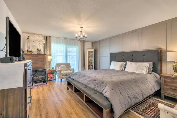 a room with a bed and television