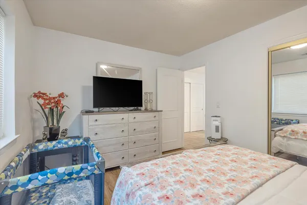 a en suite bathroom with a double vanity sink a mirror and a shower