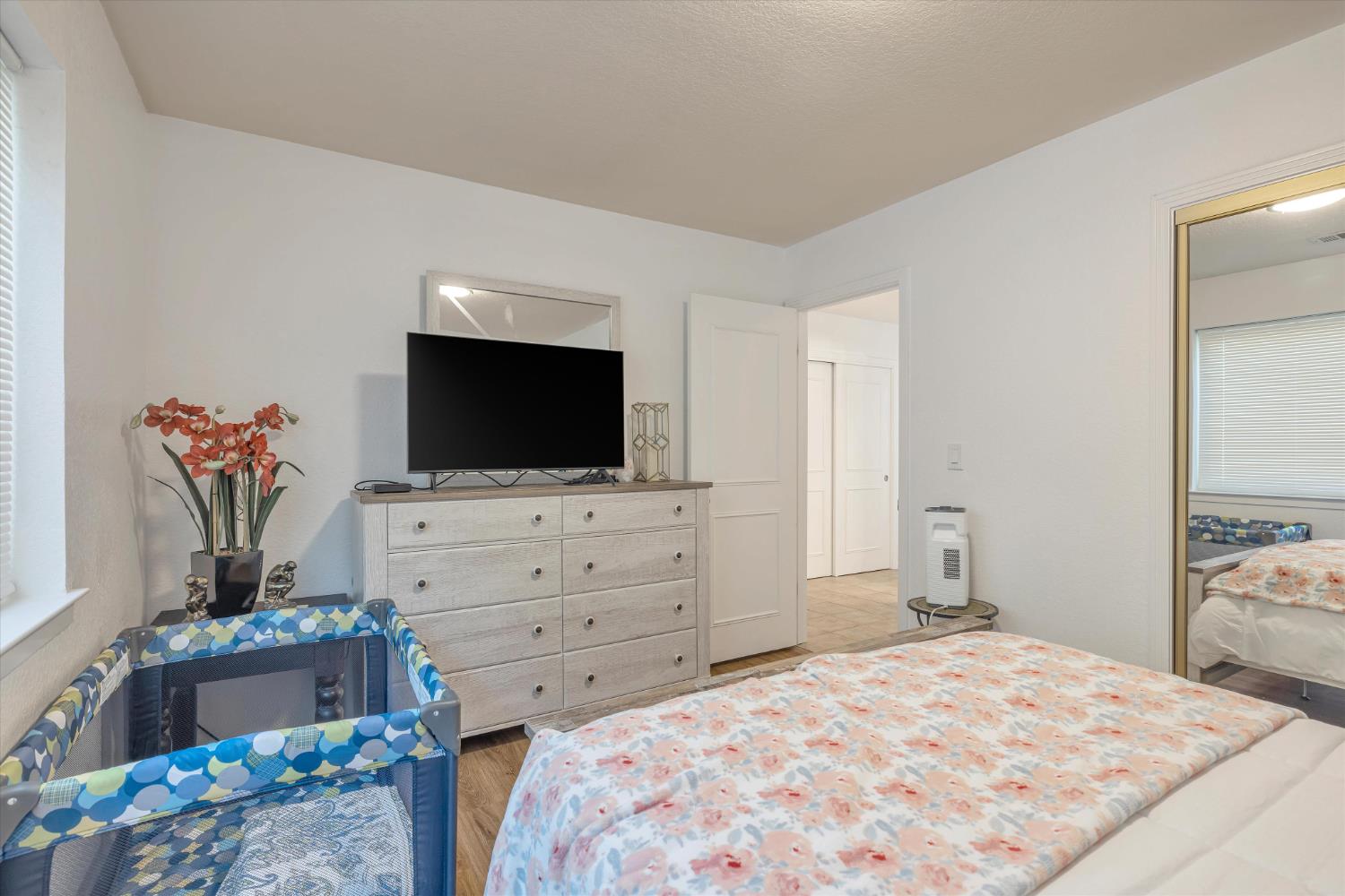 1412 Seneca Place Modesto, CA 95358 - Photo 27 of 62 a room with a bed and television