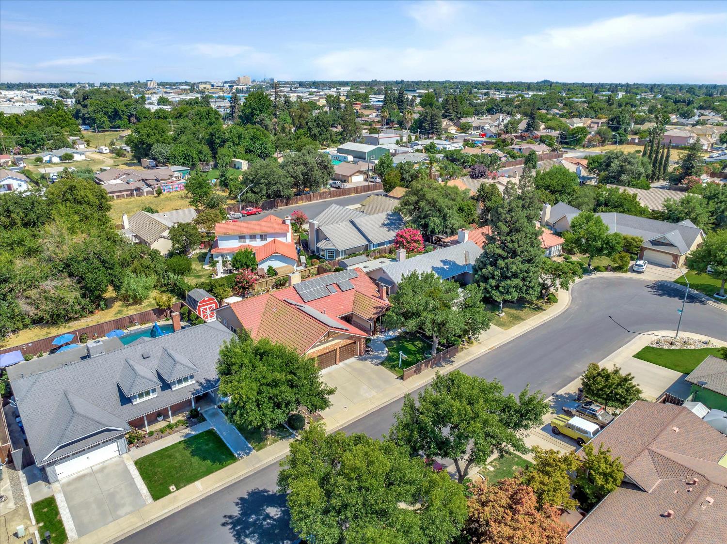 1412 Seneca Place Modesto, CA 95358 - Photo 54 of 62 an aerial view of a city with lots of residential buildings ocean and mountain view in back