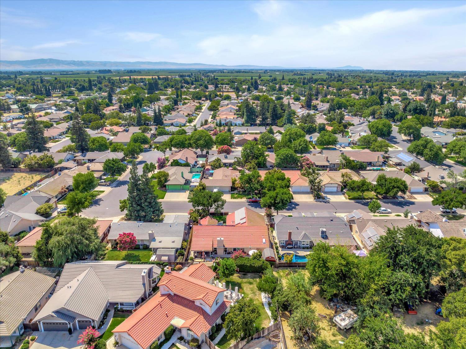 1412 Seneca Place Modesto, CA 95358 - Photo 58 of 62 an aerial view of a city with lots of residential buildings