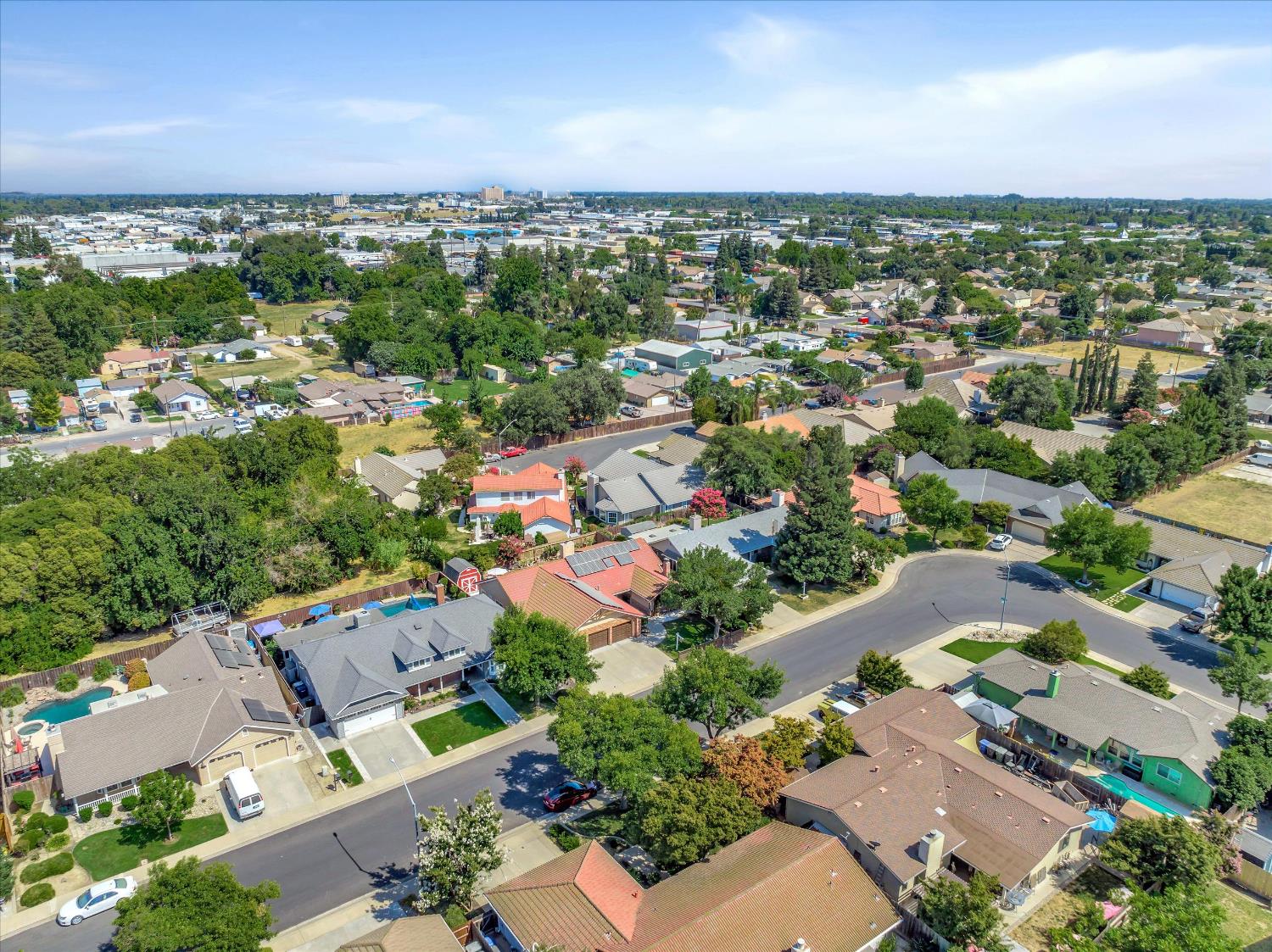 1412 Seneca Place Modesto, CA 95358 - Photo 60 of 62 an aerial view of a city with lots of residential buildings