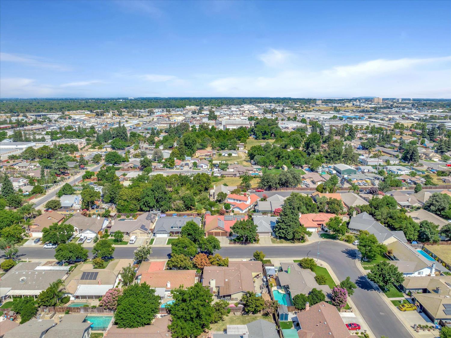 1412 Seneca Place Modesto, CA 95358 - Photo 61 of 62 an aerial view of a city with lots of residential buildings