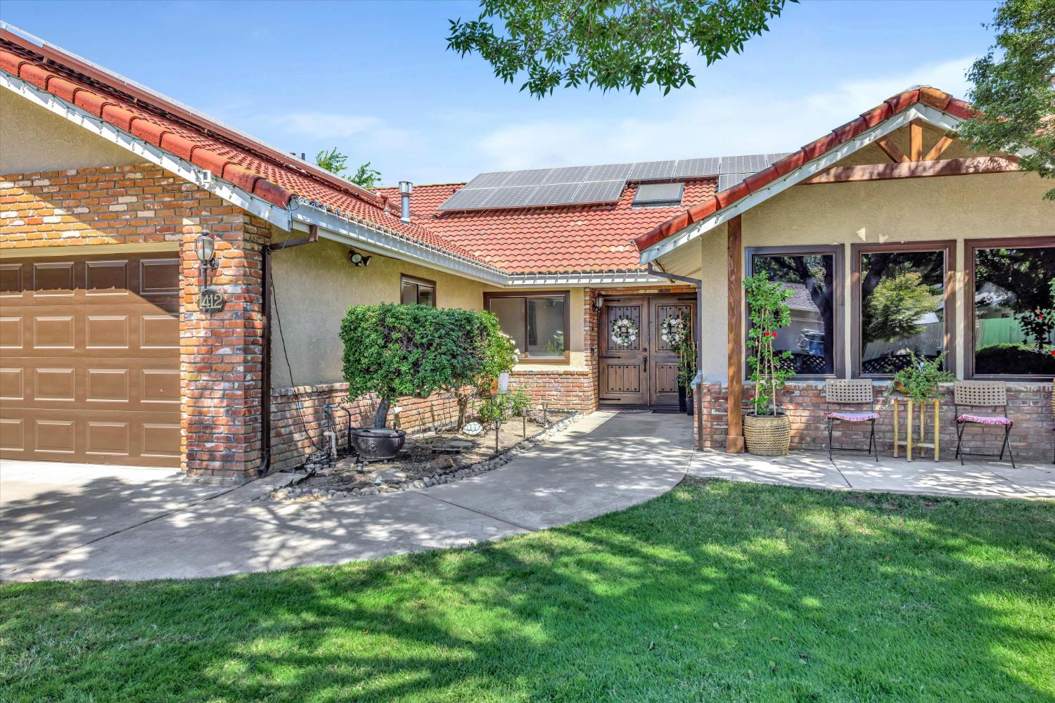 1412 Seneca Place Modesto, CA 95358 - Photo 7 of 62 a view of a house with backyard porch and sitting area