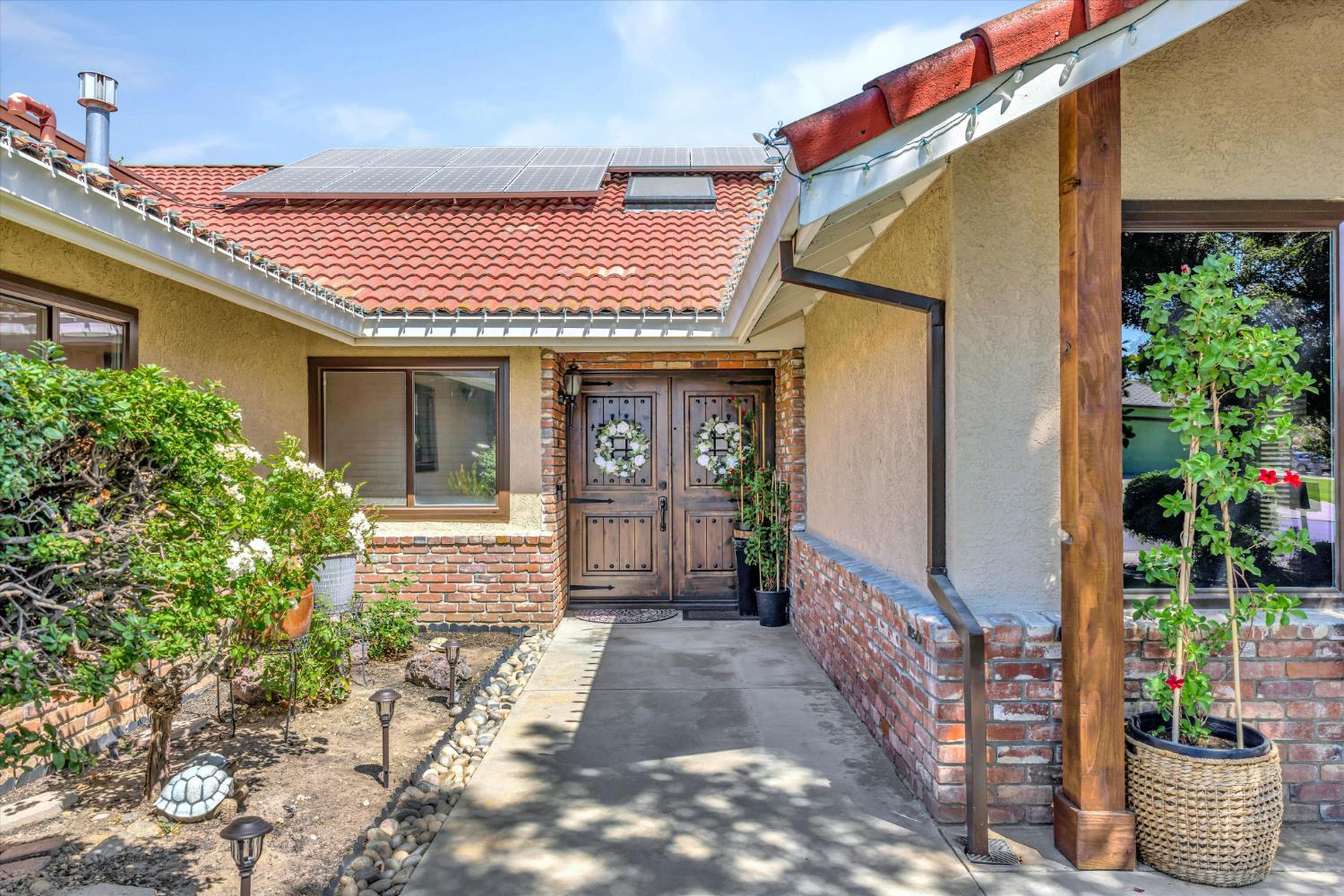 1412 Seneca Place Modesto, CA 95358 - Photo 8 of 62 a front view of a house with a porch