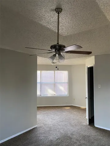 a view of a windows and chandelier fan