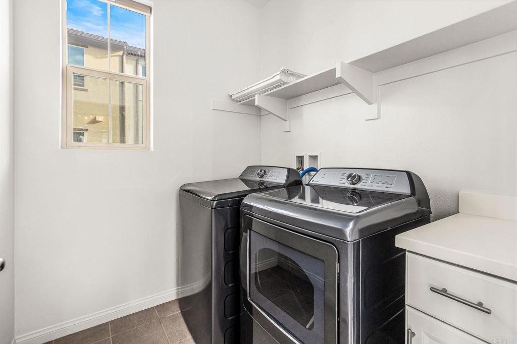 1609 Holly Leaf Way Oceanside, CA 92056 - Photo 17 of 26 a utility room with dryer and washer
