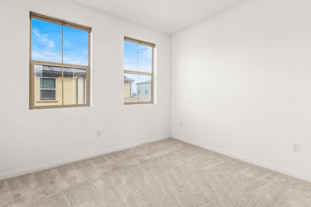 1609 Holly Leaf Way Oceanside, CA 92056 - Photo 18 of 26 a view of an empty room with a window