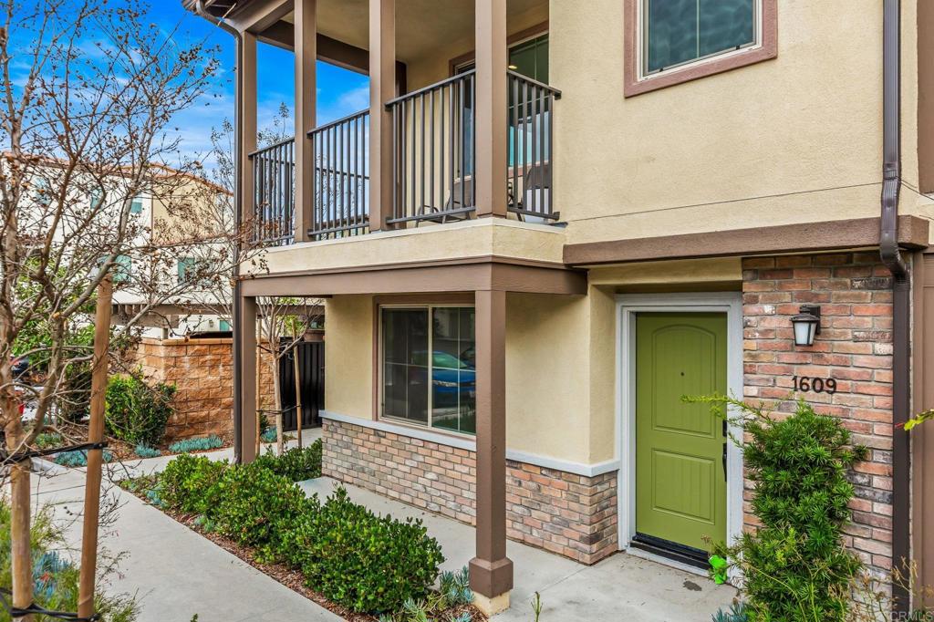 1609 Holly Leaf Way Oceanside, CA 92056 - Photo 2 of 26 front view of a house with a small yard