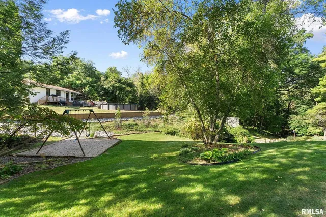 a view of a backyard with sitting area