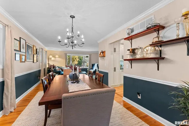 a living room with fireplace furniture and a wooden floor