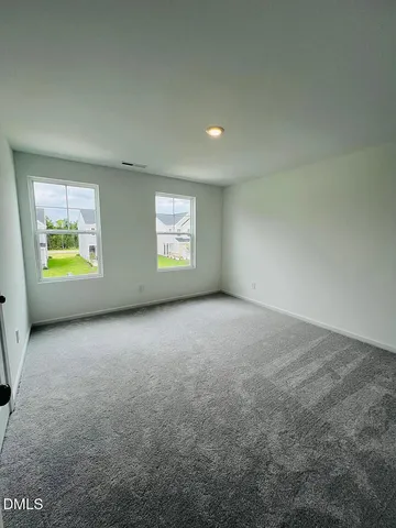 an empty room with windows and windows