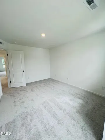 a kitchen with refrigerator a sink and a wooden cabinets