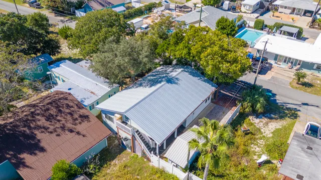 an aerial view of a house with a yard and garden