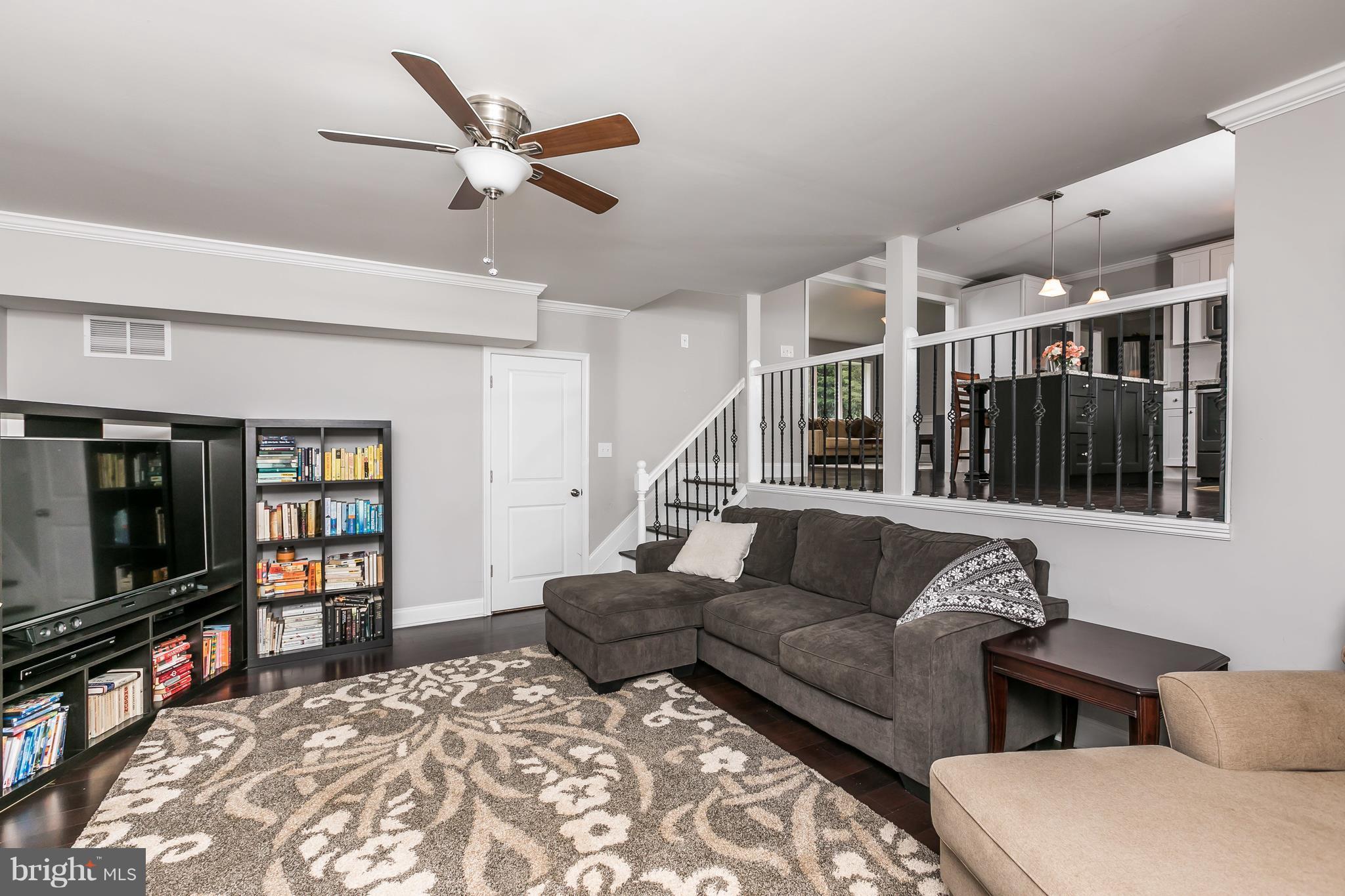 2905 Paper Mill Road Phoenix, MD 21131 - Photo 11 of 29 a living room with furniture ceiling fan and a flat screen tv