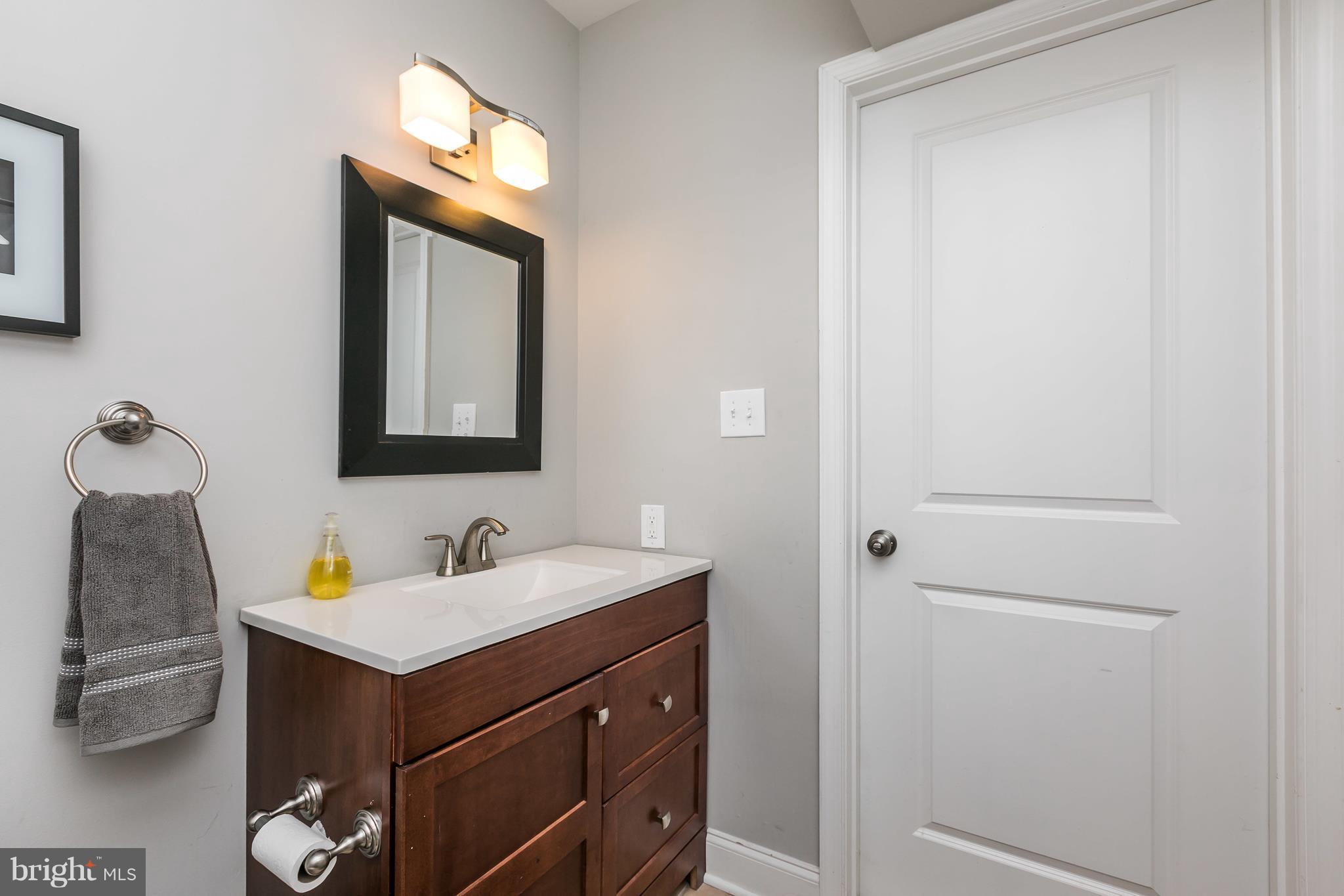 2905 Paper Mill Road Phoenix, MD 21131 - Photo 13 of 29 a bathroom with a sink vanity and a mirror
