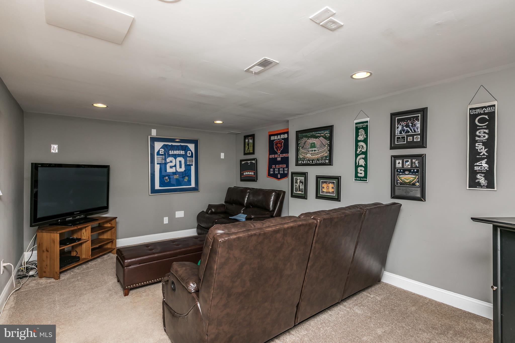 2905 Paper Mill Road Phoenix, MD 21131 - Photo 16 of 29 a living room with furniture and a flat screen tv