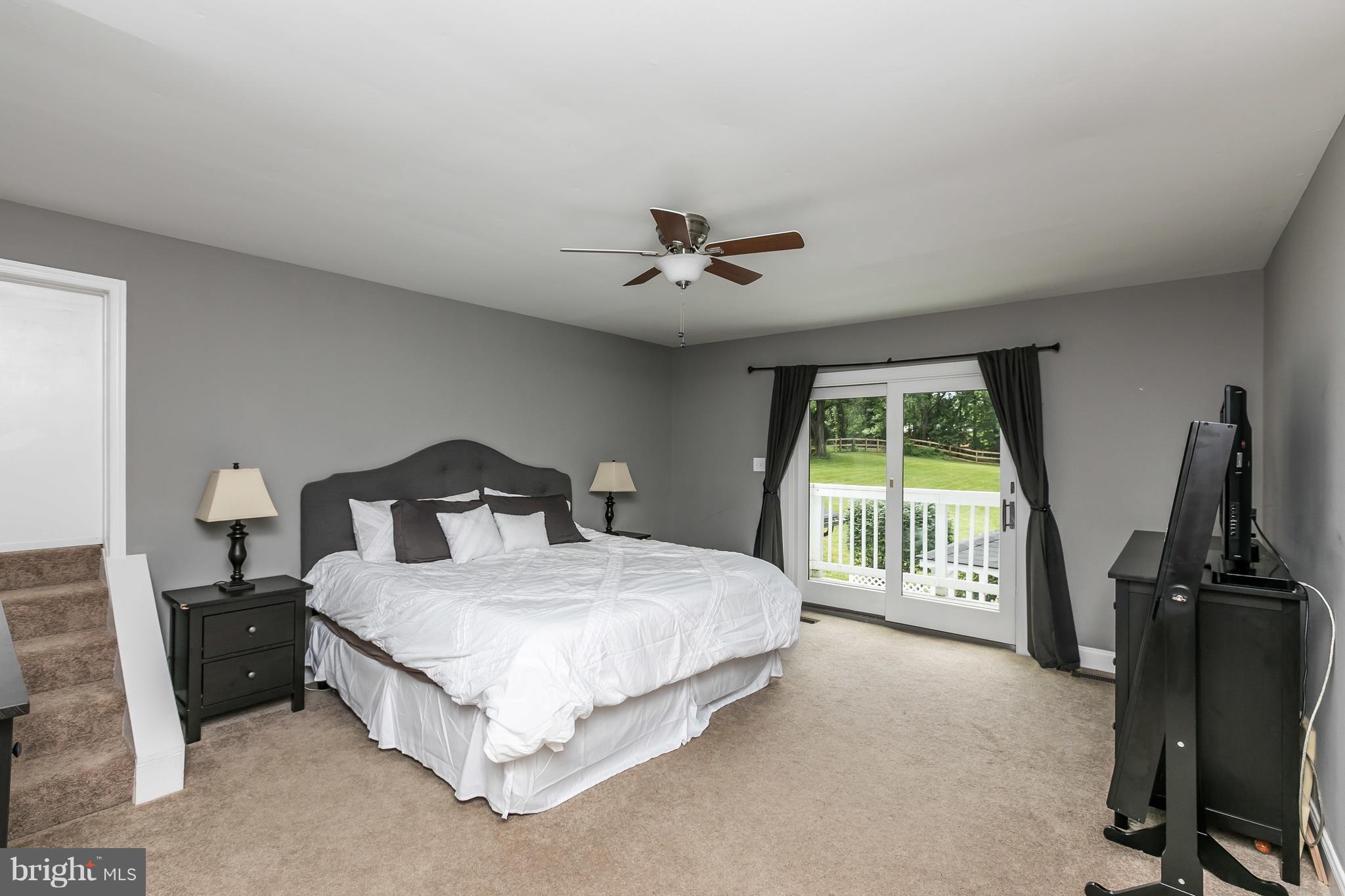 2905 Paper Mill Road Phoenix, MD 21131 - Photo 19 of 29 a bedroom with a bed and a chandelier