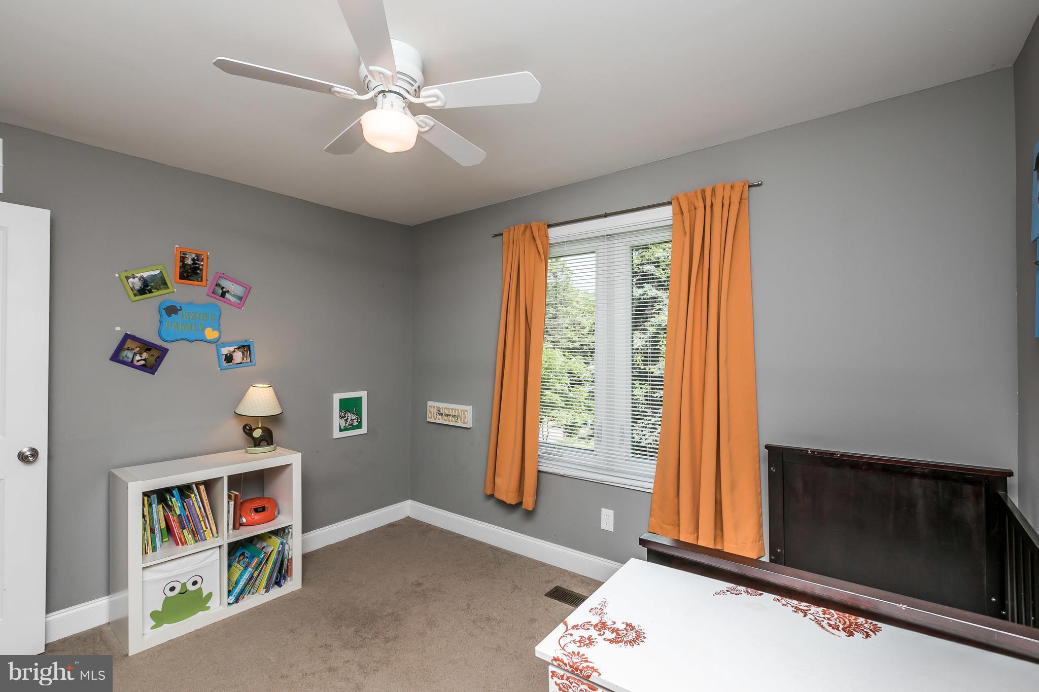 2905 Paper Mill Road Phoenix, MD 21131 - Photo 25 of 29 a living room with baby crib and a window