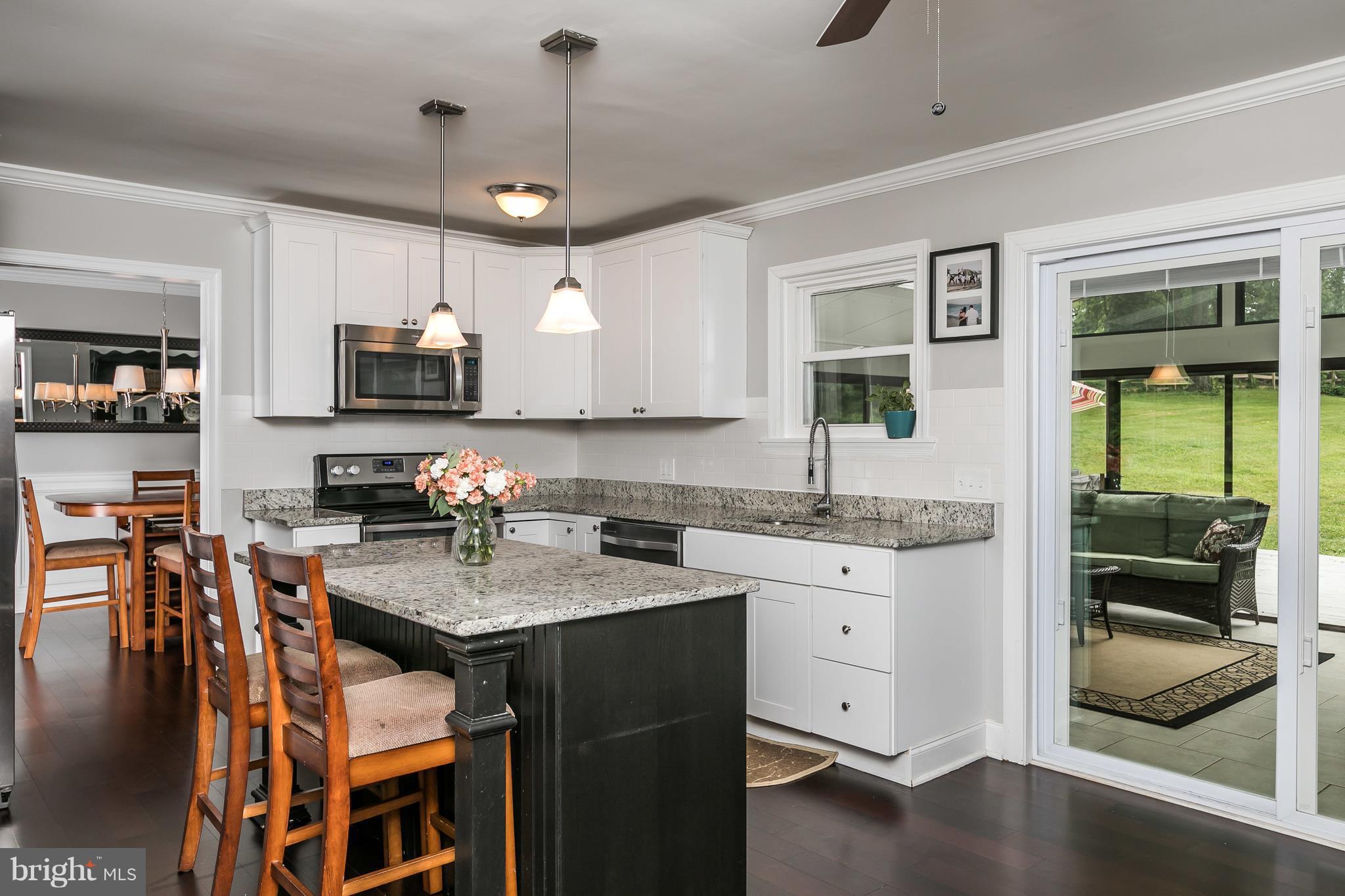 2905 Paper Mill Road Phoenix, MD 21131 - Photo 6 of 29 a kitchen with granite countertop a sink a counter top space appliances and cabinets