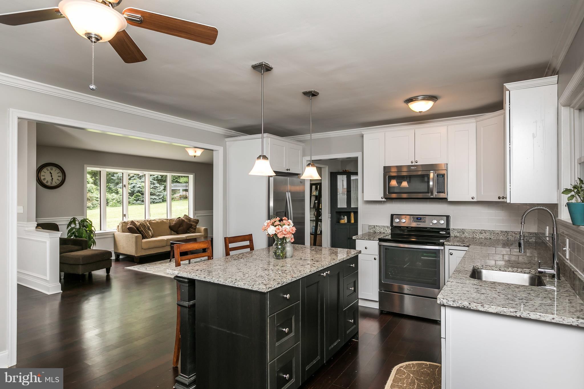 2905 Paper Mill Road Phoenix, MD 21131 - Photo 7 of 29 a kitchen with stainless steel appliances granite countertop a sink stove and refrigerator