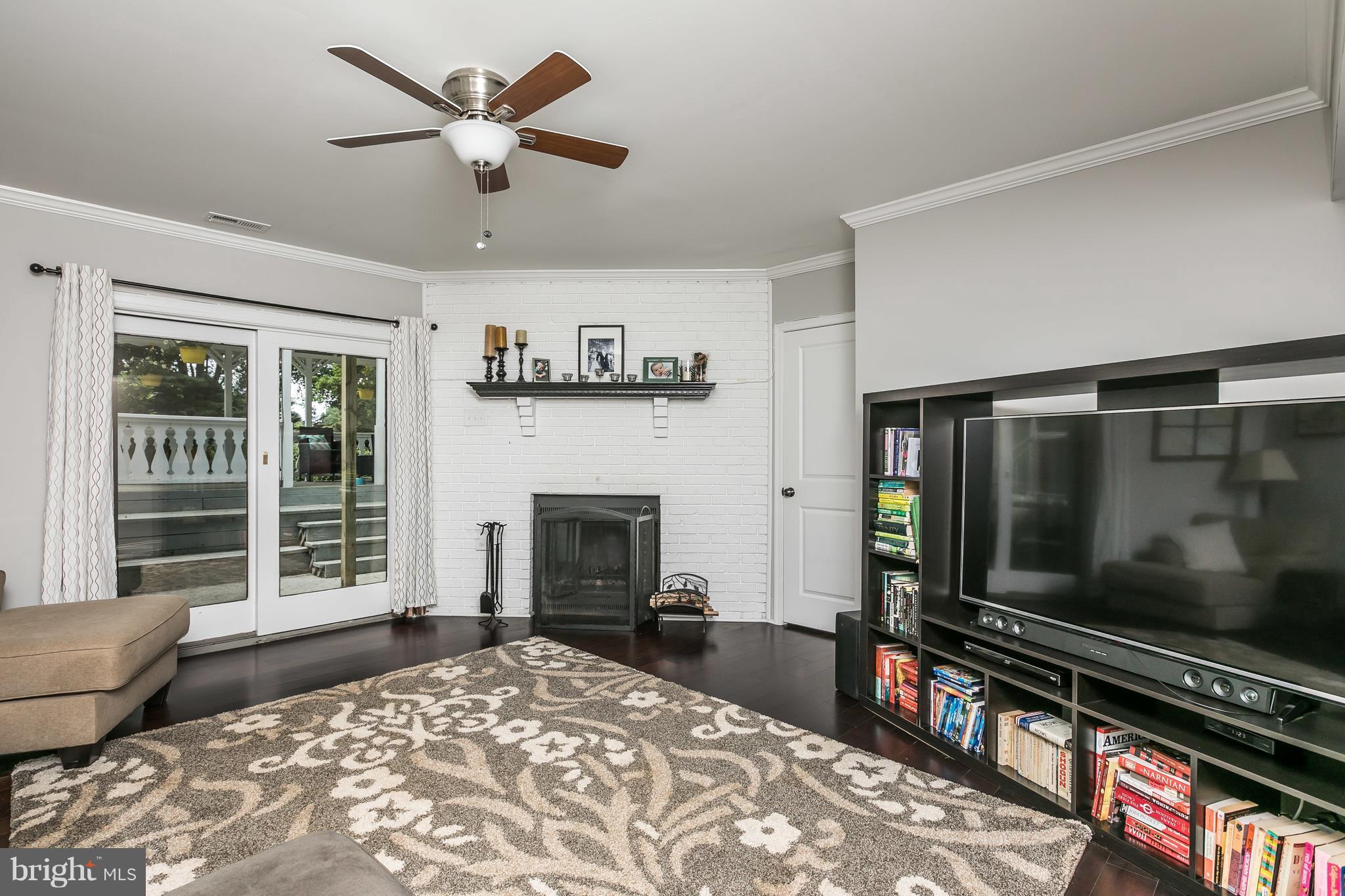 2905 Paper Mill Road Phoenix, MD 21131 - Photo 9 of 29 a living room with fireplace furniture and a flat screen tv