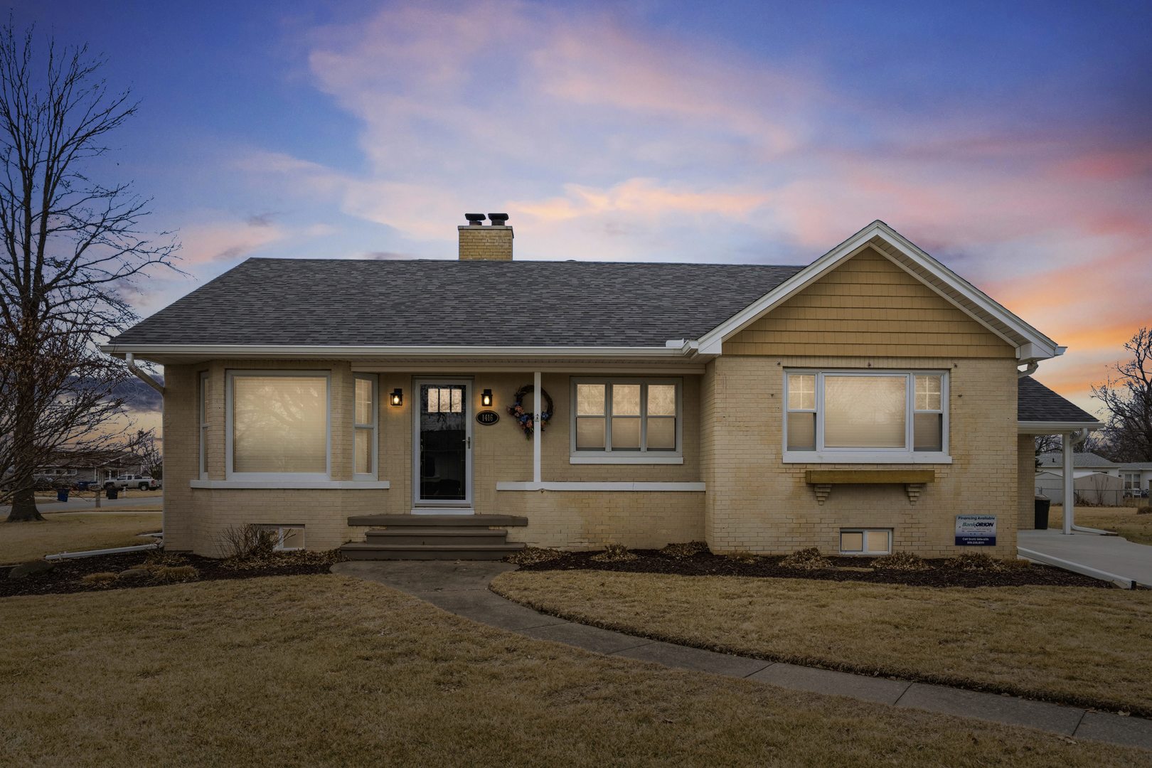 a front view of a house with yard