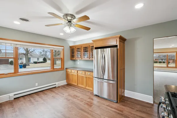 a view of a livingroom with a ceiling fan and a window