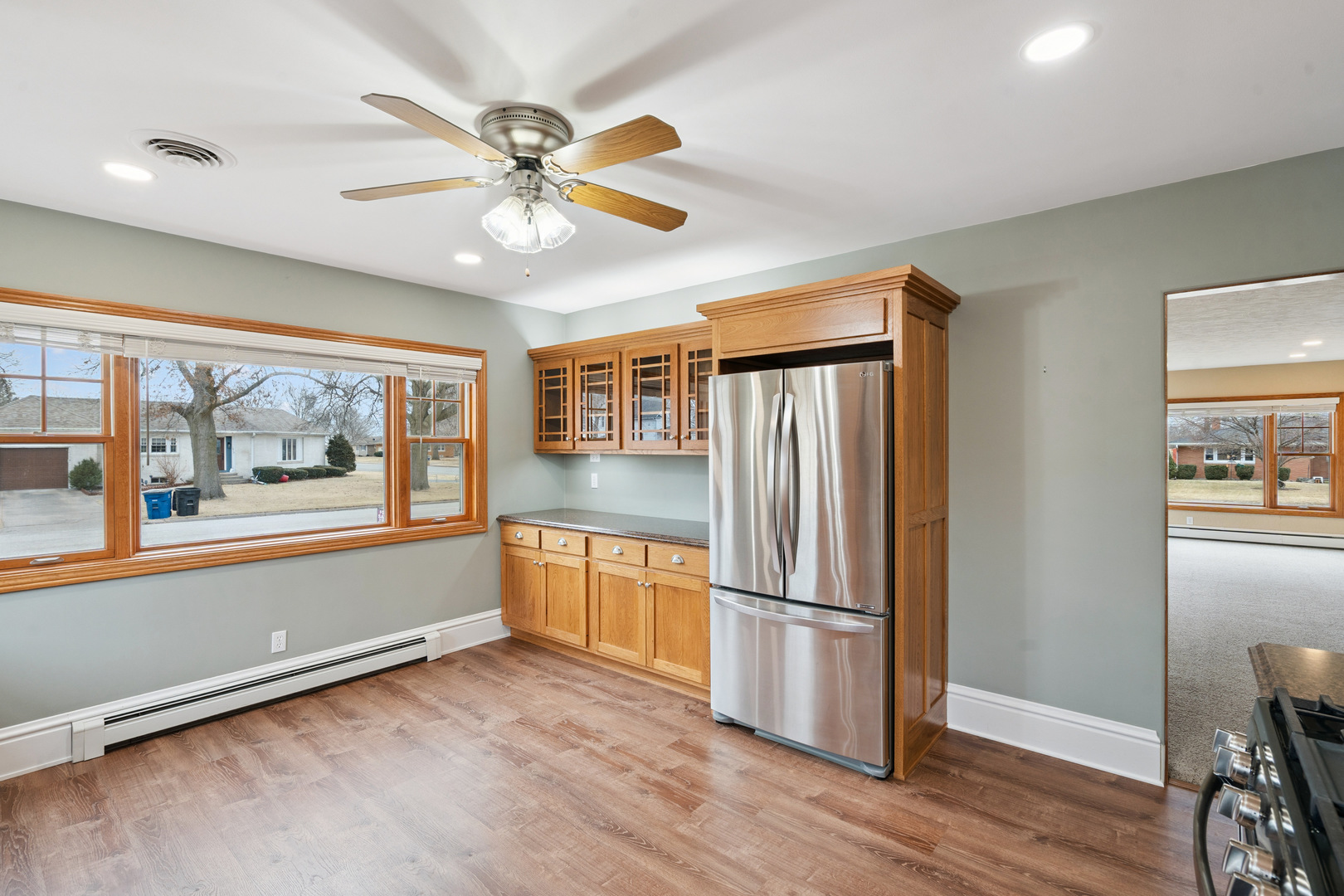 1416 6th Street Orion, IL 61273 - Photo 11 of 48 a view of a livingroom with a ceiling fan and a window