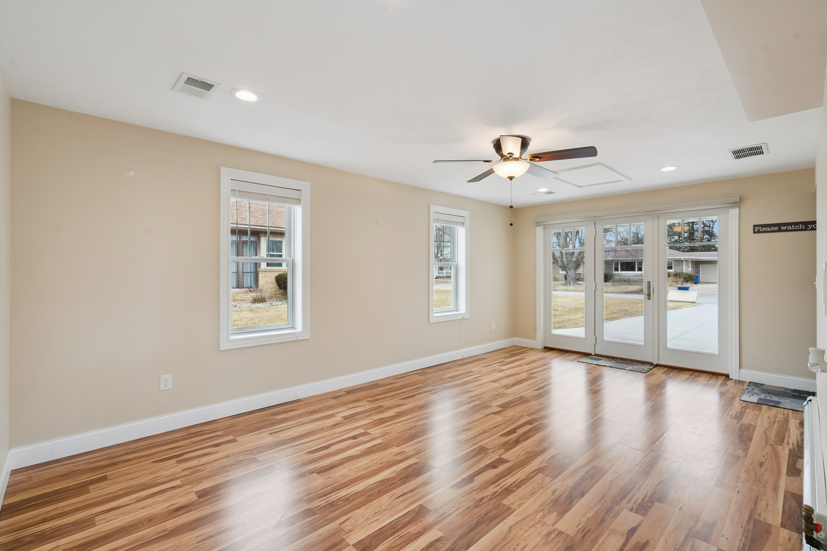 1416 6th Street Orion, IL 61273 - Photo 14 of 48 a view of an empty room with a window and wooden floor
