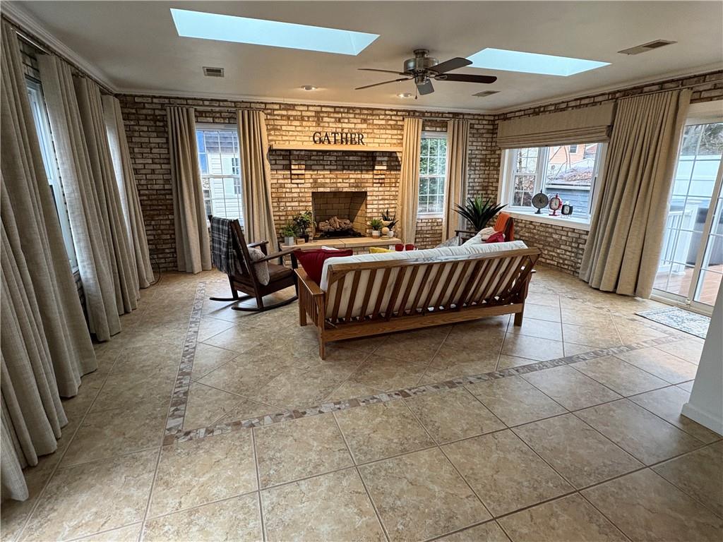 210 Carson Street Springdale, PA 15144 - Photo 24 of 33 FAMILY ROOM FROM KITCHEN NOTICE BRICK GAS FIRE PLACE