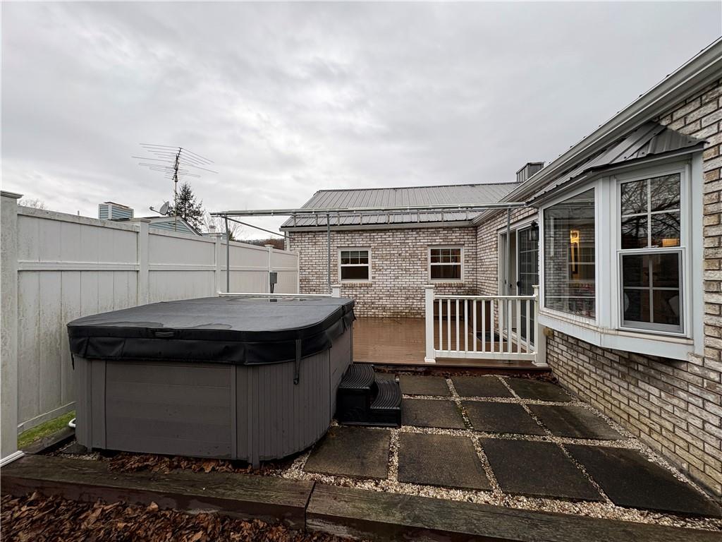 210 Carson Street Springdale, PA 15144 - Photo 6 of 33 REAR DECK WITH HOT TUB