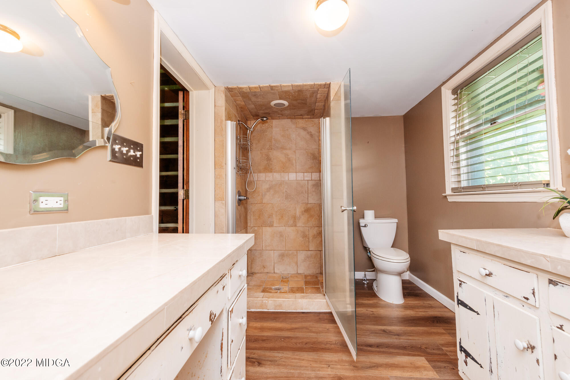 7426 Thomaston Road Macon, GA 31220 - Photo 26 of 42 a bathroom with a sink a toilet and shower