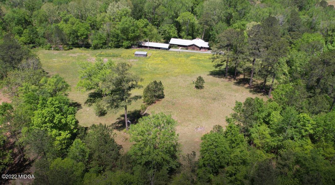 7426 Thomaston Road Macon, GA 31220 - Photo 4 of 42 a view of a lake with a yard