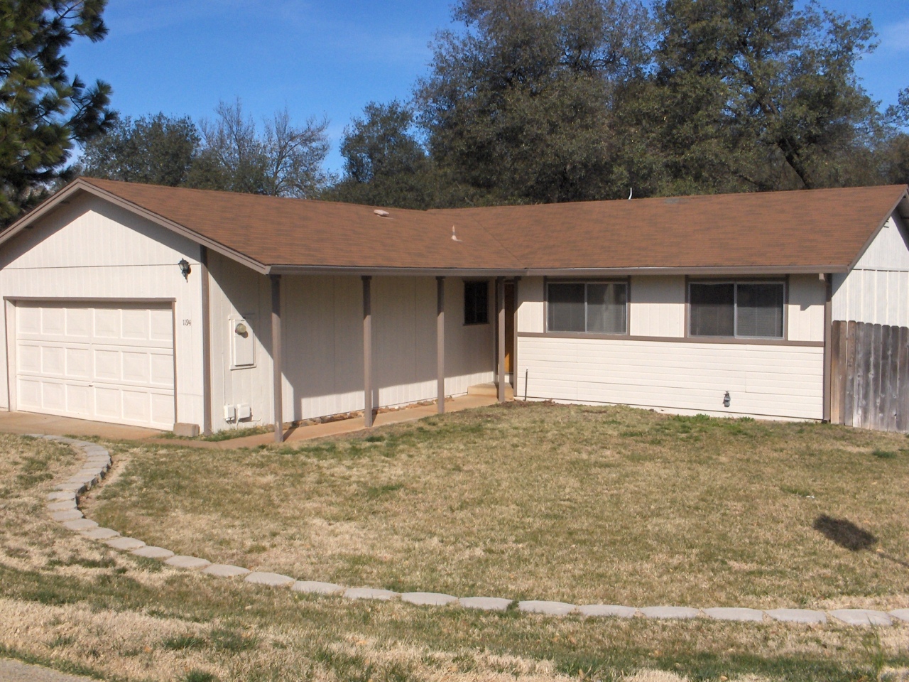 1194 Echo Road Redding, CA 96002 - Photo 1 of 17 a house with trees in the background