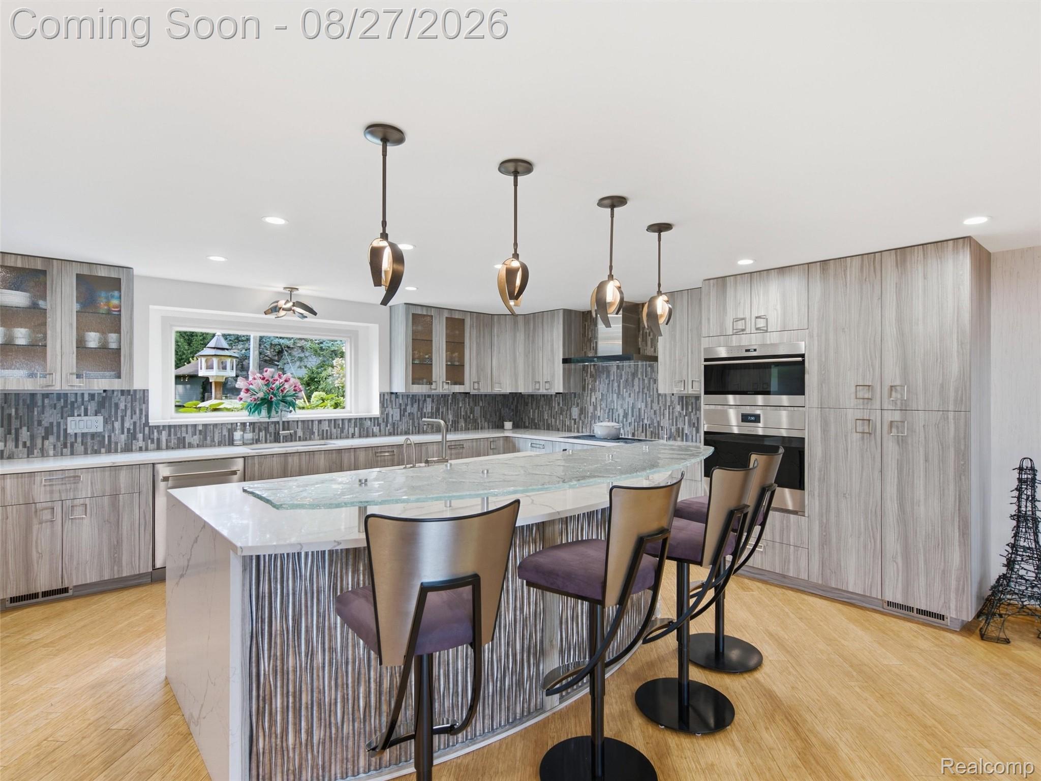 3549 Mann Road Clarkston, MI 48346 - Photo 20 of 63 Custom Tiered Island, Stainless Steel Appliances & Abundant Cabinetry