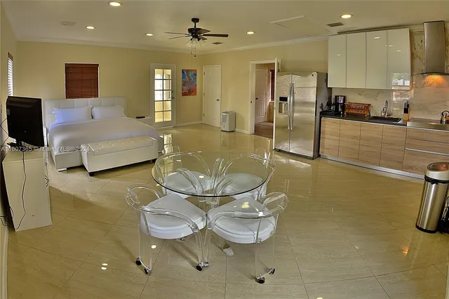 a lobby with furniture and a flat screen tv