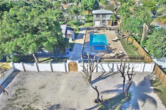a view of a chairs and table in the patio