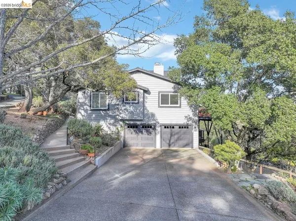 a view of a patio with table and chairs and potted plants