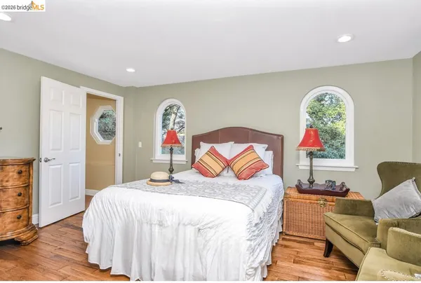 a en suite bathroom with a sink a toilet and a mirror