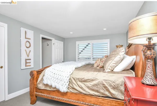 a view of an chairs and table in a room