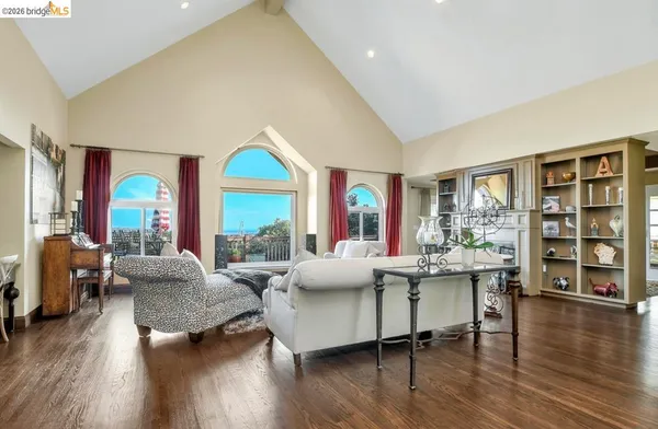 a view of a dining room with furniture and chandelier